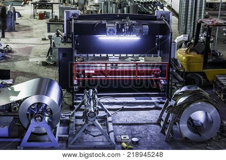 Industrial workshop or hangar on production of ventilation systems. Metalworking factory abstract background with lots of equipment and machinery, toned