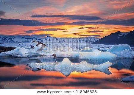 Floating icebergs in Jokulsarlon Glacier Lagoon during sunset