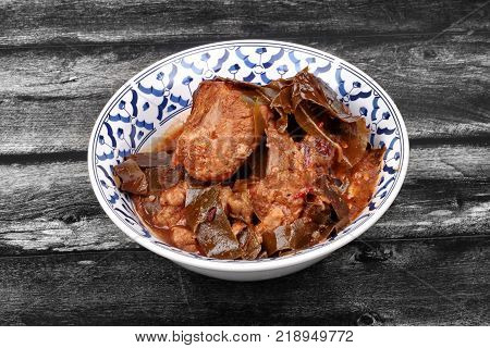 Traditional Thai herb recipeCurry pork with Chamuang (Garcinia cowa) leavesLocal Thai food call as Gang moo cha muang.