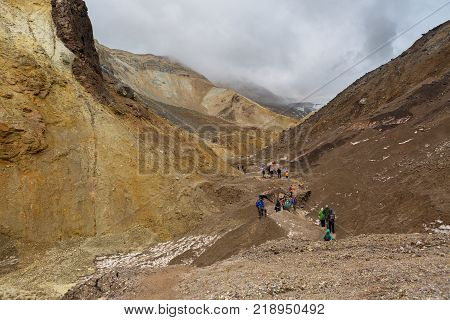 Kamchatka Peninsula, Russia - August 26, 2016: Tourists during the ascent to the active volcano Mutnovsky in Kamchatka.