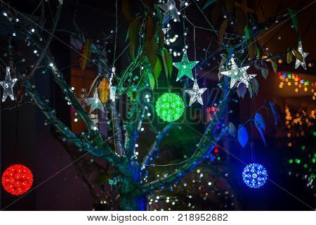 Christmas tree colorful balls and lighting stars