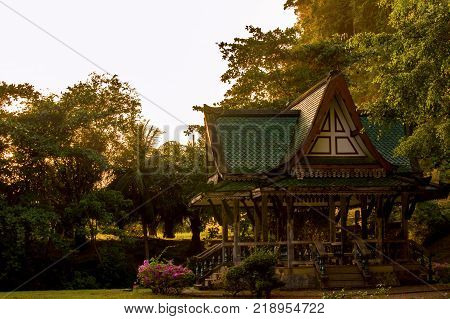 Chinese style pavilion and Tree of a park in Thailand.
