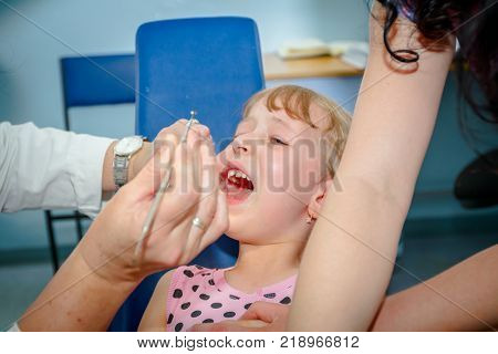 Portrait Of Sweet Little Girl With Glasses
