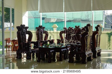 Long Xuyen Vietnam - Sep 1 2017. Wooden table and chairs at a luxury hotel in Long Xuyen Vietnam. Long Xuyen is the provincial city and capital city of An Giang Province.