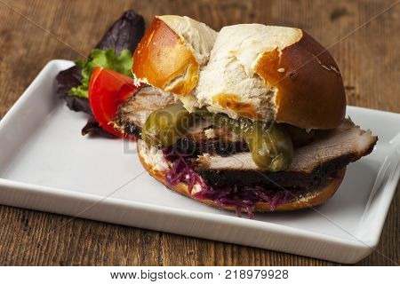 bavarian burger with roasted pork in prezel dough