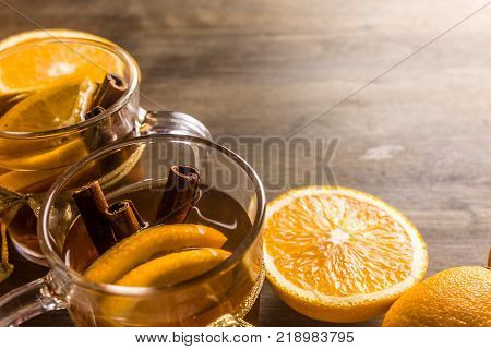 Tea flavored with orange and cinnamon oranges in glass cups
