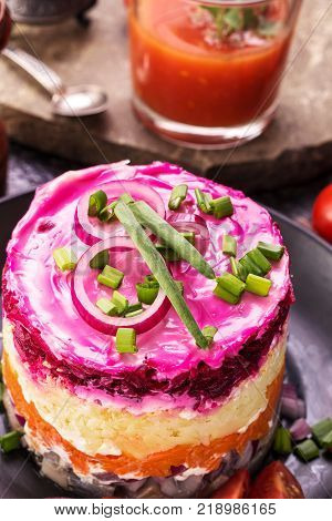 Herring under a fur coat closeup above. Russian national cuisine