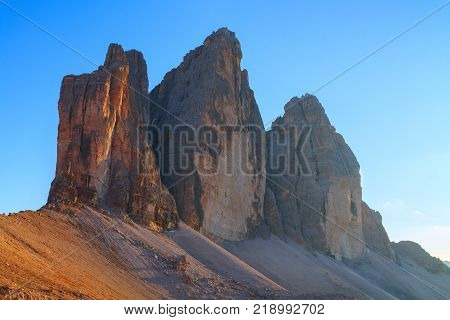 Tre Cime di Lavaredo in beautiful surroundings at sunset in the Dolomites in Italy Europe (Drei Zinnen)