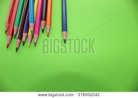 Drawings With Colored Pencils On A Green Background.many Colors.