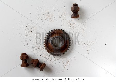 Rusty Bolts, Nuts And Gear Wheel Made Of Chocolate Isolated On White Background. Chocolate Chip Scat