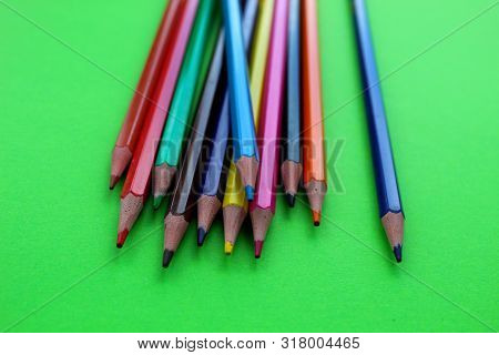 Drawings With Colored Pencils On A Green Background.many Colors.