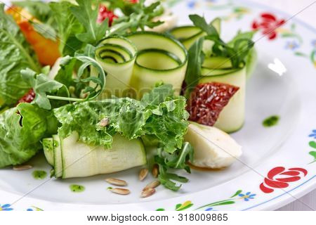 zucchini rolls with fresh salad
