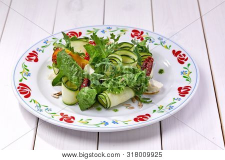 zucchini rolls with fresh salad