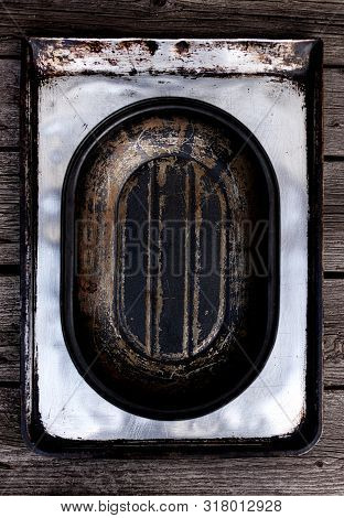 Old Vintage Baking Pan And Tins On Wooden Background. Selective Focus.