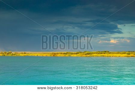 River With At Sunset. Contrasting Sky Over The River. Bright Riverbank. Pure Blue Mountain River Riv