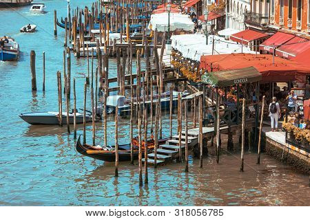Venice, Italy - May 25, 2019: Gondolas At Grand Canal In Italy Summer Time