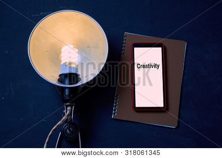 Business Idea, Individuality And Creativity. Success And Motivation. Vintage Lamp, Smartphone And No