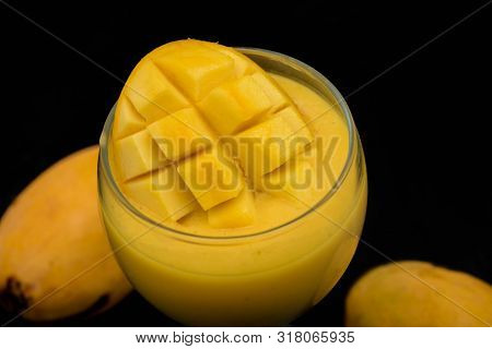 Mango Fruit Slice Shake Close Up On Black Background