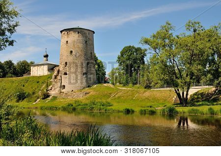 View Of The Gremyachaya Tower (part Of The Medieval Pskov Fortress) Over The Pskova River, Pskov, Ru