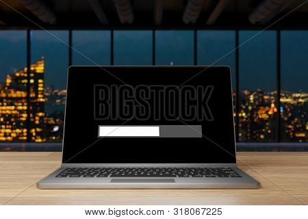 Laptop On Wooden Desk In Modern Large Indsutrial Opffice At Nighttime Skyline View, Loading Screen P