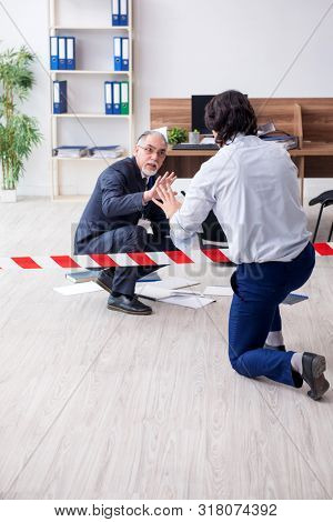 Forensic investigator investigating theft in the office