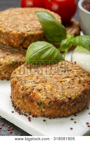 Tasty Vegetarian Burgers Made From Healthy Quinoa, Basil, Tomatoes And Mozzarella Cheese