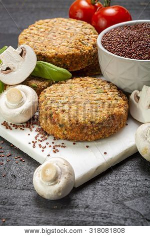 Tasty Vegetarian And Vegan Burgers Made From Healthy Quinoa, Basil, Tomatoes And Champignon Mushroom