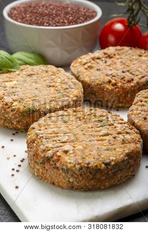 Tasty Vegetarian Burgers Made From Healthy Quinoa, Basil, Tomatoes And Mozzarella Cheese