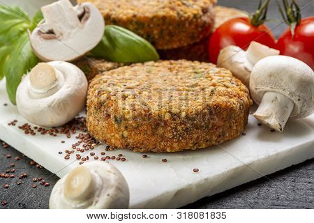 Tasty Vegetarian And Vegan Burgers Made From Healthy Quinoa, Basil, Tomatoes And Champignon Mushroom