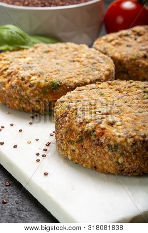Tasty Vegetarian Burgers Made From Healthy Quinoa, Basil, Tomatoes And Mozzarella Cheese