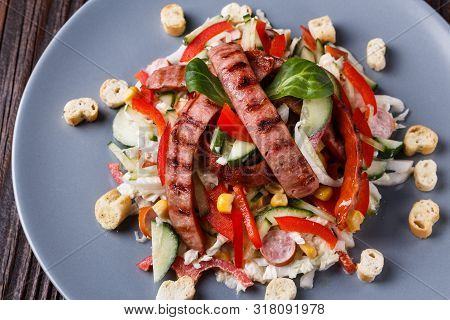Salad With Grilled Sausage Paprica Cucumber And Croutons