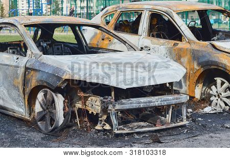 Burnt Car After A Fire, Body Parts Burnt Door Handles And Cracked Glass, The Picture Is Not Pleasant