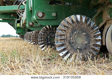Farm Tractor Tillage Equipment In A Field Ready To Plow