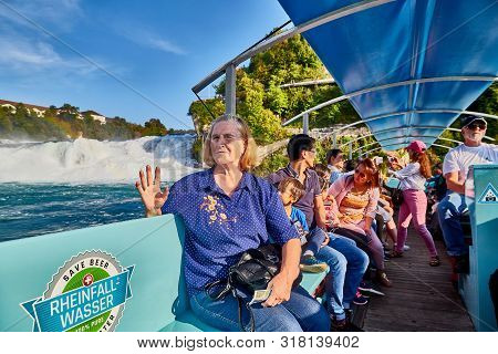 Rhine, Switzerland - September 19, 2018: Tourists Sitting In The Boat On The River Rhine Near The Rh