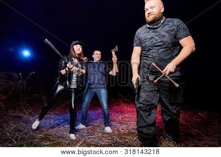 Two Gangsters And Brutal Man In A Field. Photoshoot About Life Of Gungsters In Russia