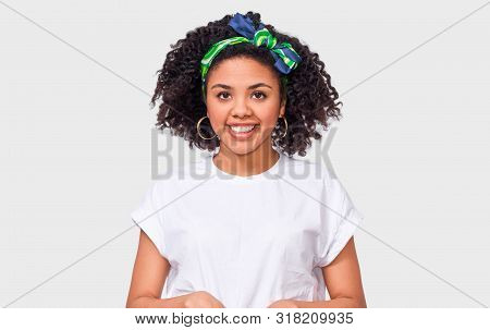 Beautiful Happy Dark-skinned Young Woman Dressed In White T-shirt, Feeling Happy. African American F