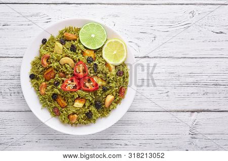 Palak Paneer Biryani At White Wooden Background. Palak Paneer Biryani Is Vegetarian Indian Cuisine D