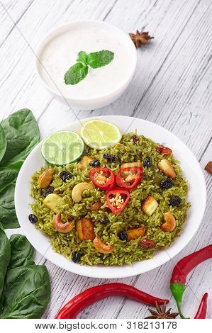 Palak Paneer Biryani At White Wooden Background. Palak Paneer Biryani Is Vegetarian Indian Cuisine D