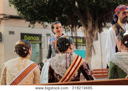 Valencia, Spain- March 12, 2018: Women Falleras Majors Of Valencia Chatting, Dressed In The Typical 