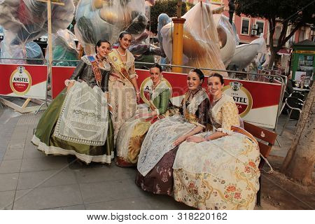 Valencia, Spain- March 12, 2018: Women Falleras Majors Of Valencia Chatting, Dressed In The Typical 
