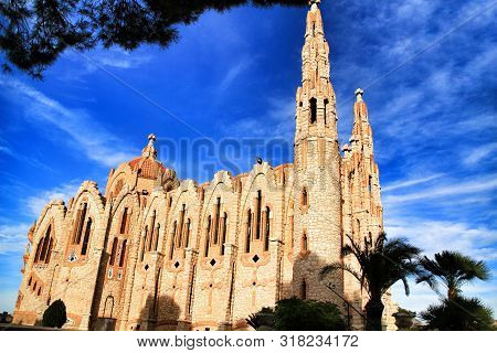 Novelda, Alicante, Spain- November 28, 2018: Details, Archs, Tower And Tiles Of Sanctuary Of Santa M