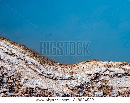 Blue Geothermal Pond At The Great Geysir, An Active Volcanic Geyser In Southwestern Iceland
