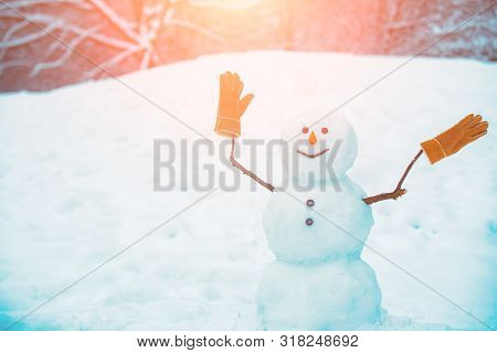 Greeting Snowman. Cute Snowmen Standing In Winter Christmas Landscape. The Morning Before Christmas.