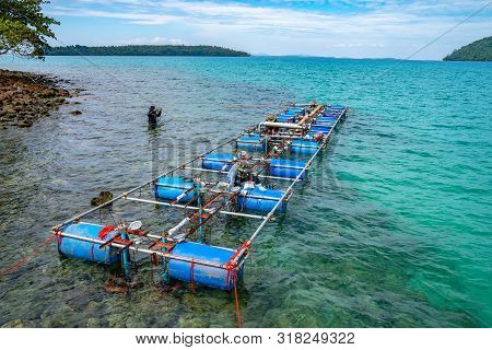 Workers Settle And Setup The Waterworks Fountain Machine On The Surface Of The Sea.