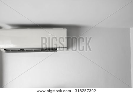 Air Conditioner Mounted On A White Wall In The Living Room Or Bedroom. Indooor Comfort Temperature. 
