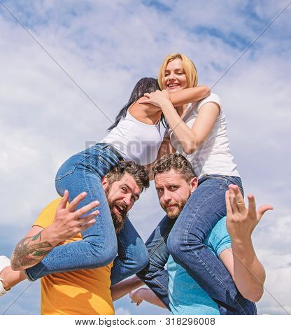 Friendship Of Families. Twice Fun On Double Date. Couples In Love Having Fun. Men Carry Girlfriends 