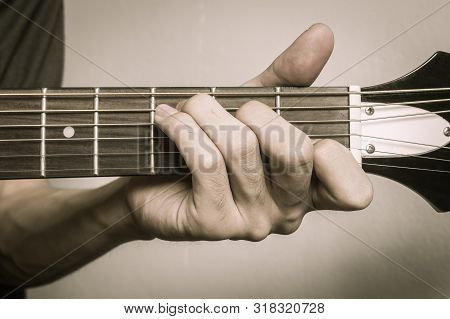Guitar Player Hand Or Musician Hand In C Major Chord On Acoustic Guitar String With Soft Natural Lig