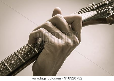 Guitar Player Hand Or Musician Hand In C Major Chord On Acoustic Guitar String With Soft Natural Lig