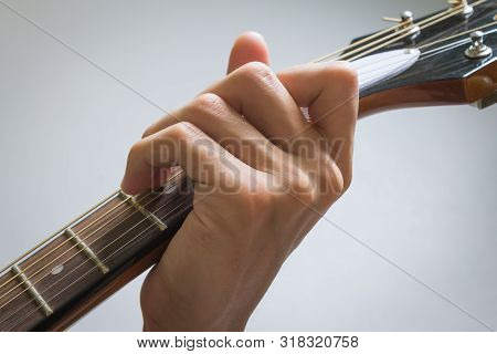 Guitar Player Hand Or Musician Hand In C Major Chord On Acoustic Guitar String With Soft Natural Lig