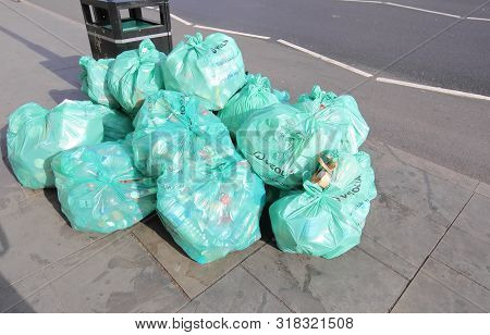 London England - June 2, 2019: Rubbish In Veolia Plastic Bag Piled In Downtown London Uk